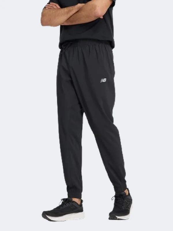 men's 36-inch athletic navy pants-New Balance Essential Woven Men Performanc Pant Black